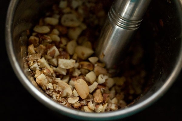 crushing roasted peanuts coarsely. 