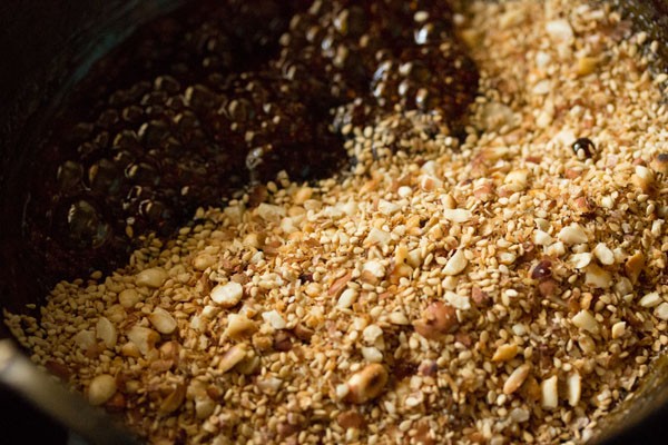 roasted sesame-coconut-peanut-cardamom powder added to jaggery syrup. 
