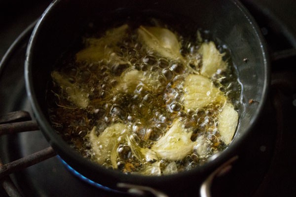 garlic cloves added to oil