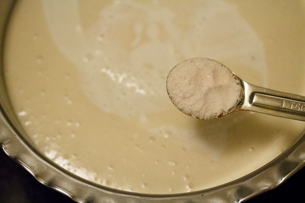 adding salt to idli batter