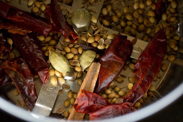 roasted whole spices in a coffee grinder