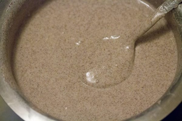 making ragi flour batter. 