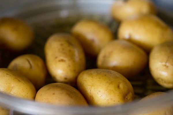 parboiling baby potatoes for tandoori aloo recipe. 