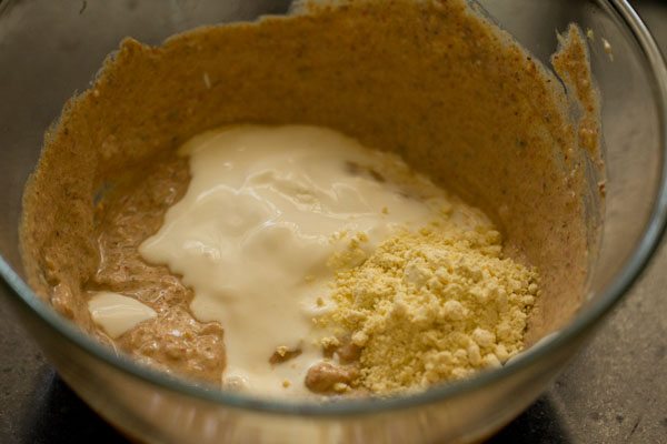 low fat cream and gram flour added to the spiced hung curd mixture. 