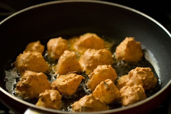 aloo tikka placed in the hot oil. 