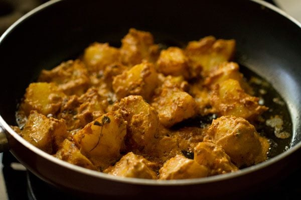 pan frying marinated potato pieces. 