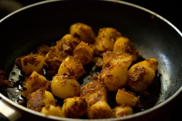 pan frying potato pieces till crisp and golden. 