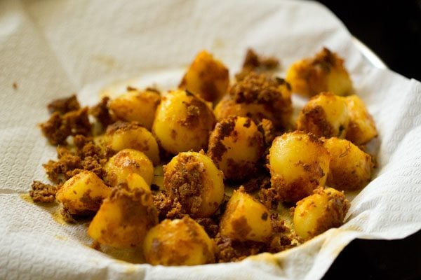 pan fried potato pieces on kitchen paper towel. 