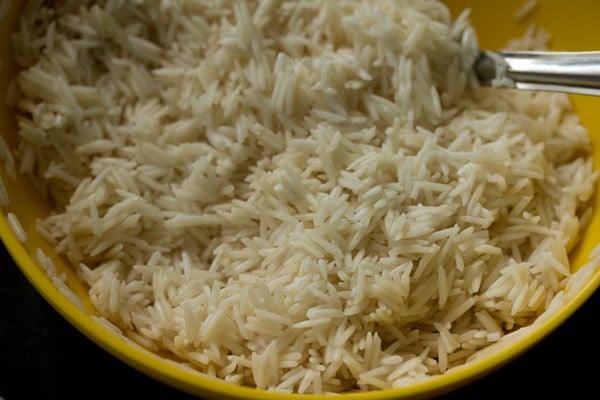 mixing oil and salt in the drained rice with a spoon. 