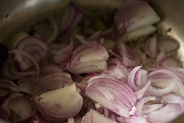 sliced onions added to hot oil. 