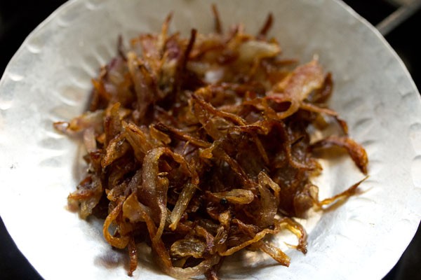 some fried onions on a plate. 