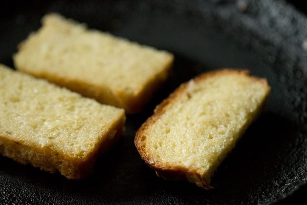 toasting the bread slices on hot tawa. 