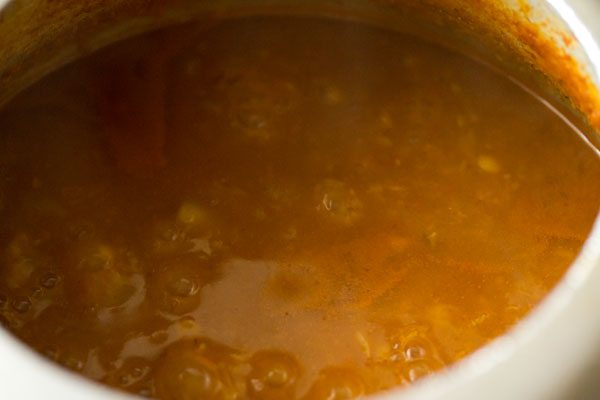 simmering the tomato sambar