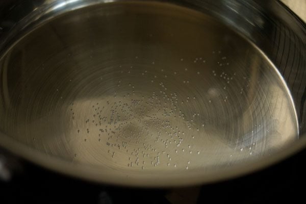 heating water in a pan.