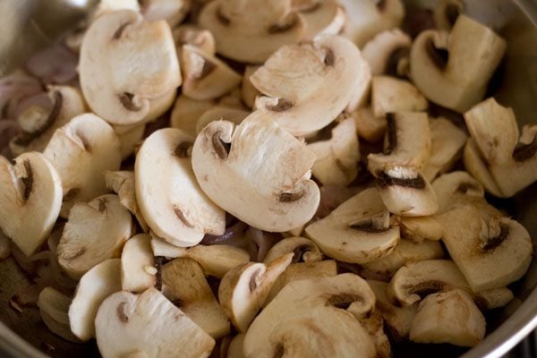 adding sliced mushrooms