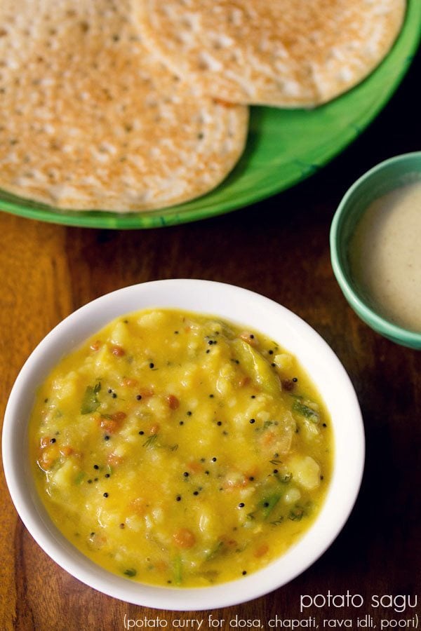 potato sagu served in a white bowl with a plate of dosas, a small bowl of coconut chutney and text layovers.