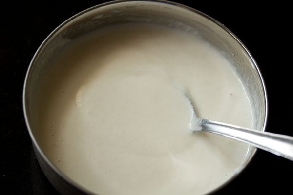 idli batter in a bowl.