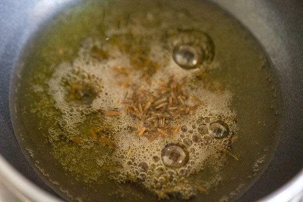 cumin seeds added to hot ghee