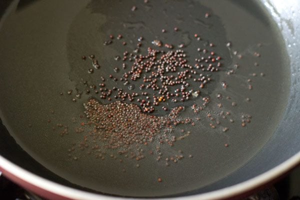 Add mustard seeds in oil