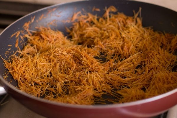 roasting vermicelli in ghee for making sweet vermicelli. 