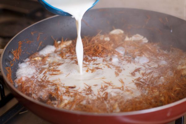 pouring milk in the pan. 