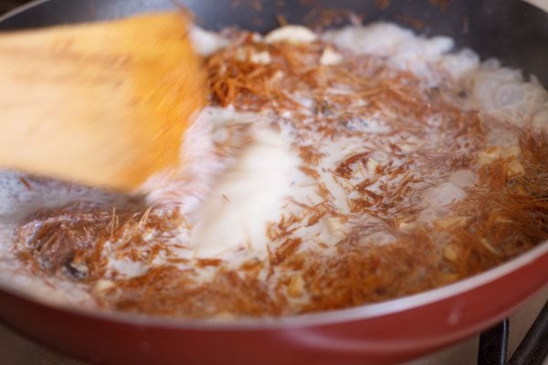 stirring milk into the vermicelli. 