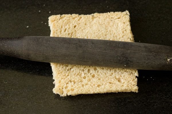 flattening a bread slice. 