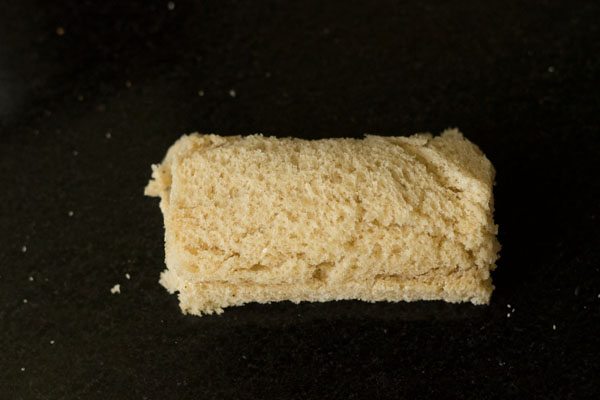 bread slice covered gently to form a rectangular roll. 