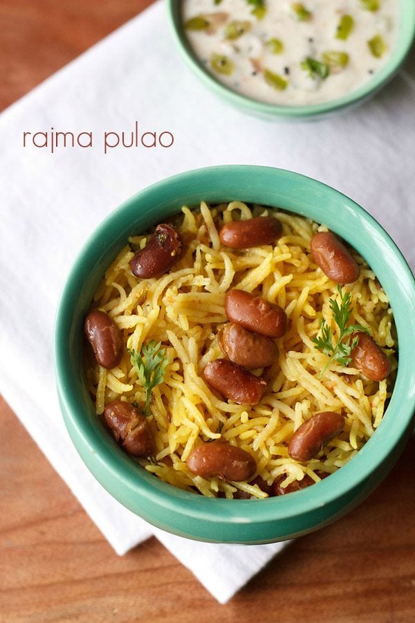 rajma pulao garnished with coriander leaves and served in a bowl with raita and text layover.
