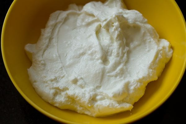 greek yogurt in a yellow bowl