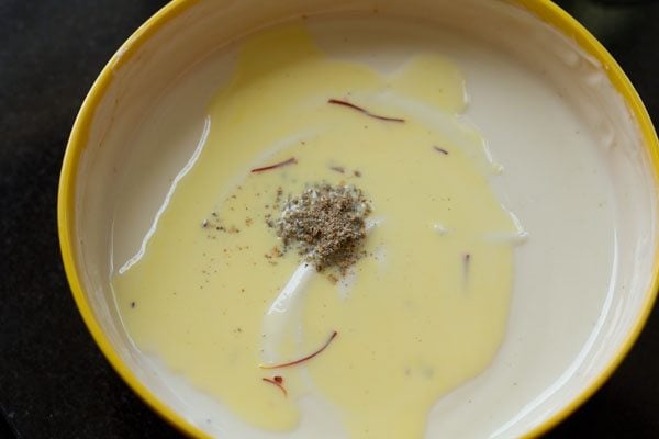 saffron infused milk and ground cardamom on top of creamy whipped yogurt
