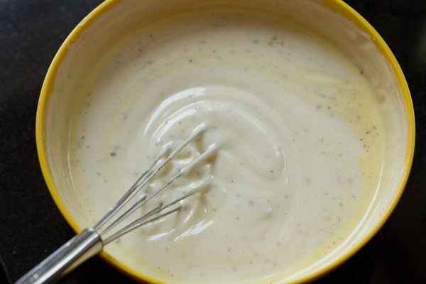 flavorings being mixed with wired whisk