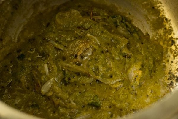 mixing ground masala paste