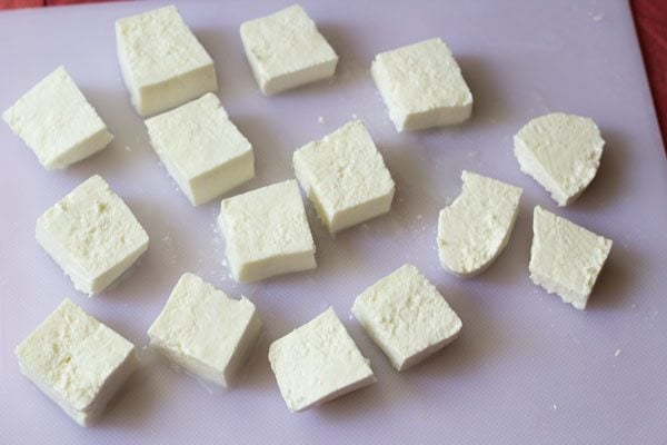 paneer cubes on chopping board