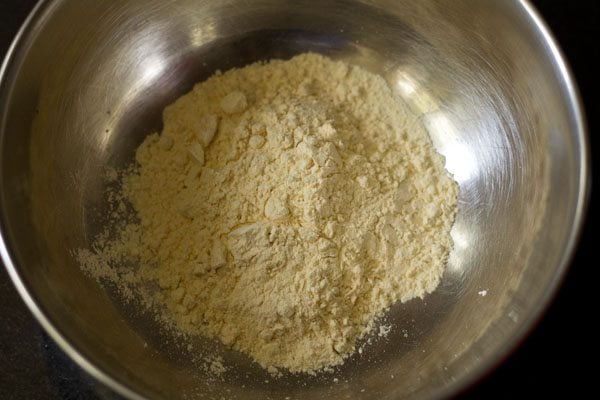 gram flour added to a mixing bowl. 