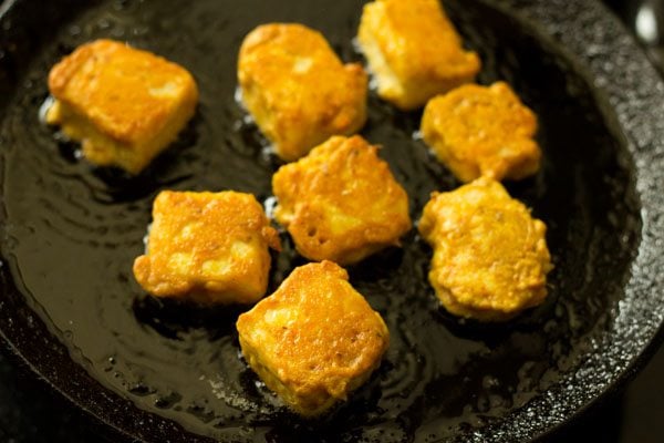 pan frying amritsari paneer tikka cubes