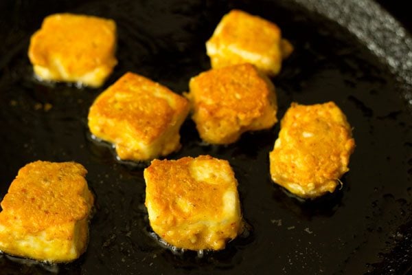 pan frying amritsari paneer tikka cubes