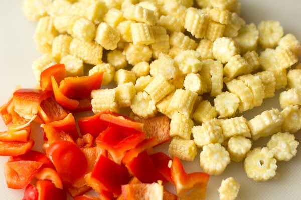 sliced baby corn and chopped red bell pepper.