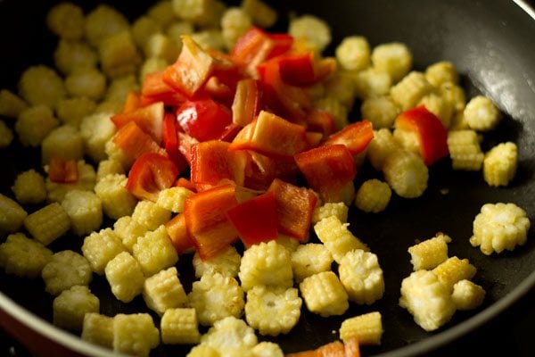 chopped red bell pepper added to the pan.