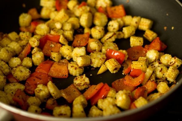 mixing the ingredients in the pan. 