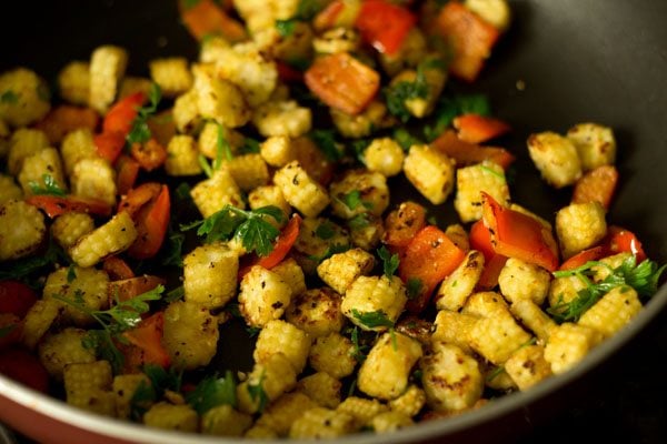 parsley leaves mixed well with the baby corn and red bell pepper.