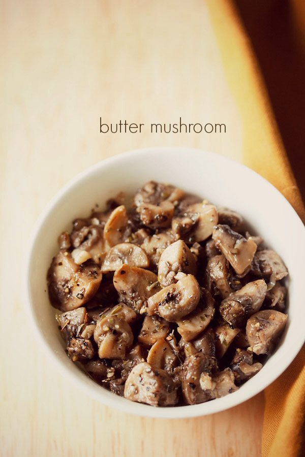 garlic butter mushrooms served in a white bowl with text layovers.