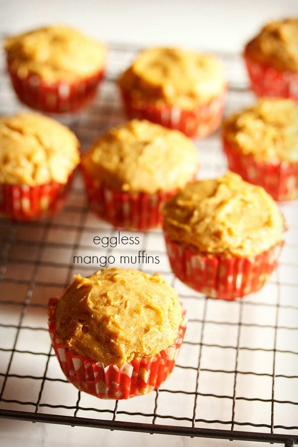 mango muffins placed on a wired tray with text layovers.