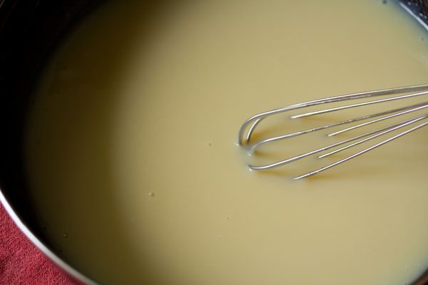whisking the butter-condensed milk to a homogenous mixture. 