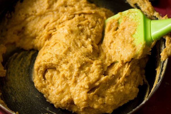 folding the mango-flour mixture into a batter. 