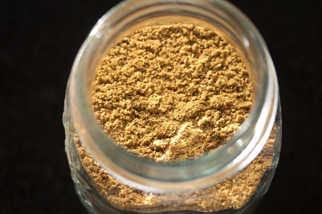 homemade garam masala powder placed in a glass jar