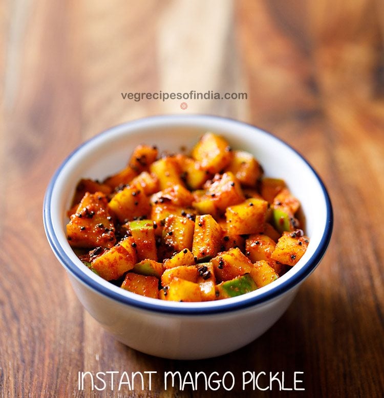 nurukku manga achar or kerala style instant mango pickle served in a white bowl. 