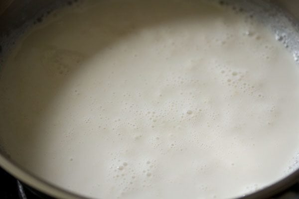 heating milk in the pan. 