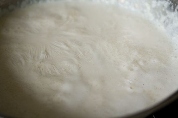 cooking the sweetened rice-milk mixture. 