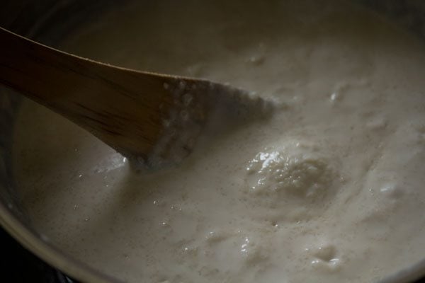 keep scraping the sides often and adding in the simmering milk. 